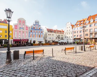 View on the Market square with beautiful colorful buildings during the morning light in Szczecin city, Poland