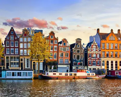 Amsterdam Netherlands dancing houses over river Amstel landmark in old european city spring landscape.