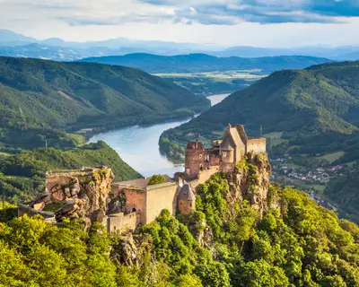 Beautiful landscape with Aggstein castle ruin and Danube river at sunset in Wachau, Austria