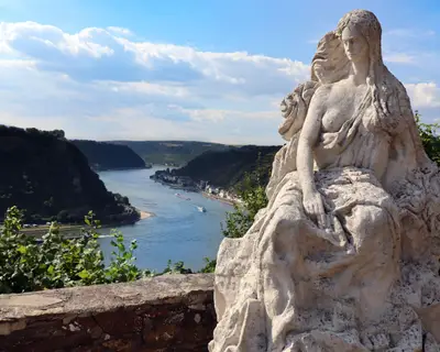 Loreley by Rhine in Germany. Beautiful view from the high cliff and the famous statue on top of it.