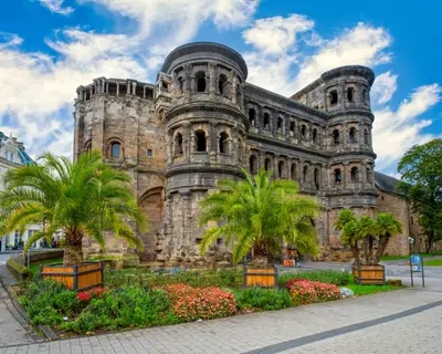 Amazing view of famous Porta Nigra (Black gate) - ancient Roman city gate in Trier, Germany. It is today the largest Roman city gate north of the Alps. UNESCO World Heritage Site.