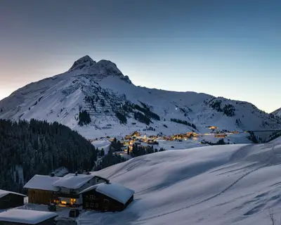 The Austrian ski resort Warth in winter at dusk in the snowy Alps.