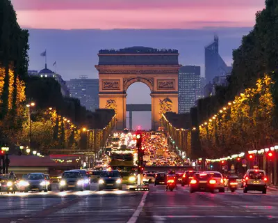 Champs Elysees and Arc de Triomphe in Paris France. night scene with car traffic