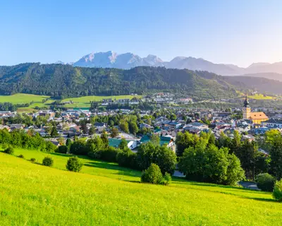Panoramic view of Schladming and Dachstein Mountain Group on background at sunrise time. Rocky ridge with Hoher Dachstein, 2995 m. Northern Limestone Alps, Austria.