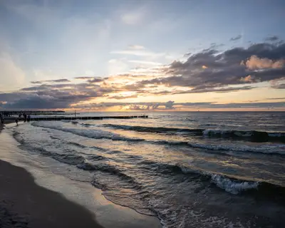 Enjoying stroll on seaside promenade in Kolobrzeg, Poland