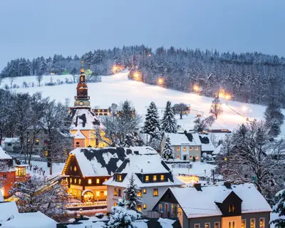 Illuminated houses in Seiffen at Christmastime. Saxony, Germany